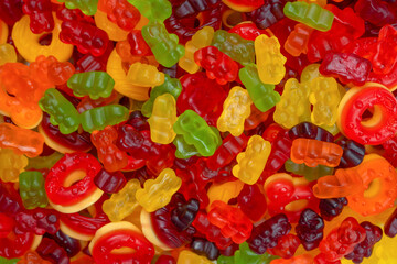 Assorted colorful gummy candies. Jelly donuts. Jelly bears.