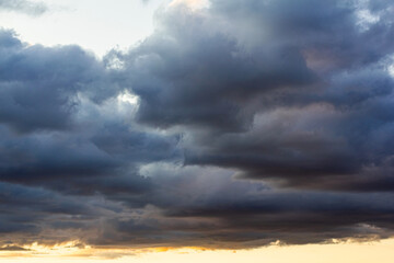 A haunting stormy sky. Cloudy clouds in the setting sun. A natural phenomenon
