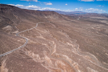 Fototapeta na wymiar Death Valley with Empty Road in Background. California, USA.