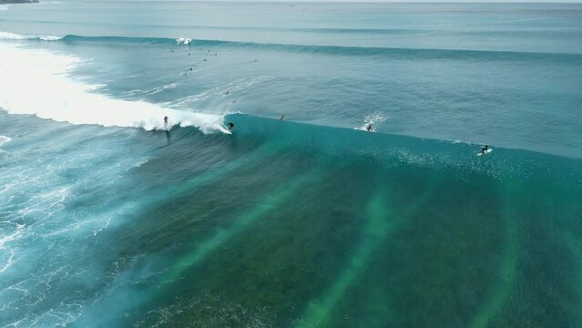 Aerial view with surfing on wave. Waves with surfers in ocean