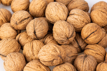 Walnut in shell isolated on white background. Energy boost for the day. The concept of proper nutrition. Tasty breakfast.