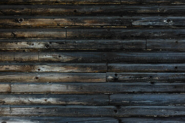 Old wooden house wall in nature.