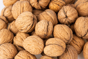 Walnut in shell isolated on white background. Energy boost for the day. The concept of proper nutrition. Tasty breakfast.