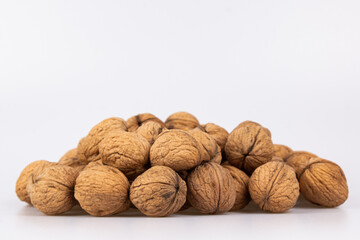 Walnut in shell isolated on white background. Energy boost for the day. The concept of proper nutrition. Tasty breakfast.