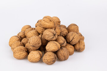 Walnut in shell isolated on white background. Energy boost for the day. The concept of proper nutrition. Tasty breakfast.