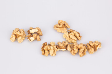 Half a walnut isolate. Peeled walnut on white. Walnut top view. Set with clipping path. Full depth of field.