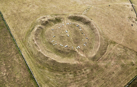 Arbow Low Neolithic henge and stone circle and adjoined bowl barrow on limestone upland near Bakewell, Derbyshire.  Parched summer drought conditions
