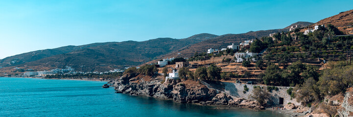 Obraz premium Kionia Beach swimming, the place to embrace the Aegean Sea, Tinos, Greece, banner size