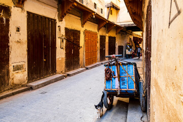 Medieval street  with closed souks in Arabic old town called medina in Fes, Morocco,  Africa