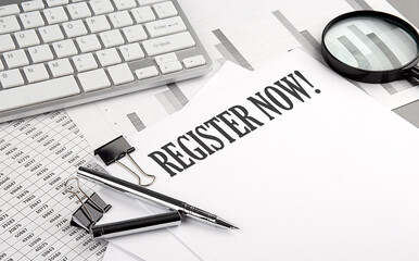 REGISTER NOW text on paper with chart and keyboard, business concept