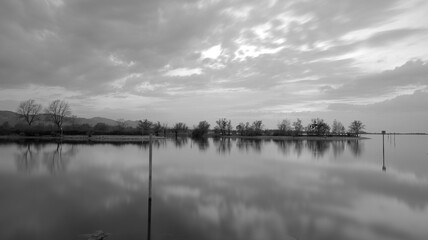 Long time exposure of Lake Constance at sunset in black and white