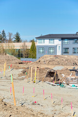 Construction zone with new building development on blue sky background