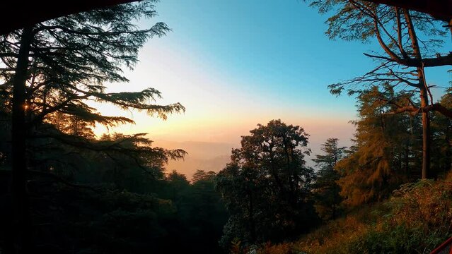 This is a short clip of the sunset and colorful clouds over the shimla mountains in Himachal Pradesh, India.