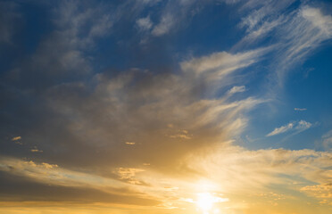 Naklejka na ściany i meble sunset scenery blue sky and yellow shiny sinking sun