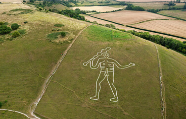 Cerne Abbas Giant, Dorset. Ancient male phallic chalk hill figure. 55 metres high. Above head is...