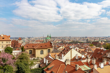 Scenic aerial view of the old town square under blue sky, Overview of architecture houses with orange brick rooftop of buildings, The City of a Hundred Spires, Prague capital of the Czech Republic.