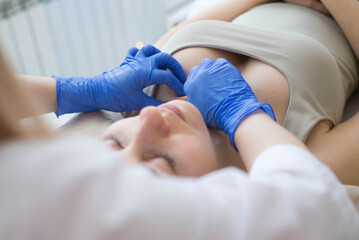Obraz na płótnie Canvas close up of a nurse holding a patient