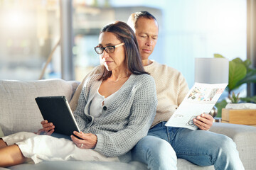 Tablet, newspaper and couple relax on sofa, bonding and streaming video at home. Technology, love...