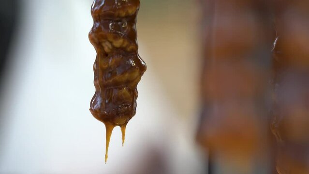 One  sweet churchkhela․ Սweet sujukh․ Caucasian pastry.   Tasty sweet food. Sugar and concentrated fresh grape juice.