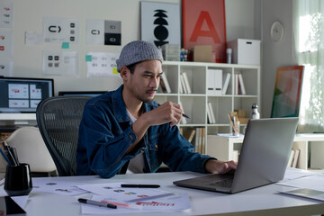 Asian man Graphic designer working in office. Artist Creative Designer Illustrator Graphic Skill...
