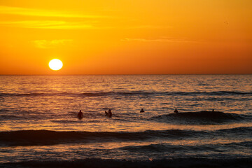 Beautiful sunset at the atlantic ocean in portugal close to lissabon. Wallpaper surf