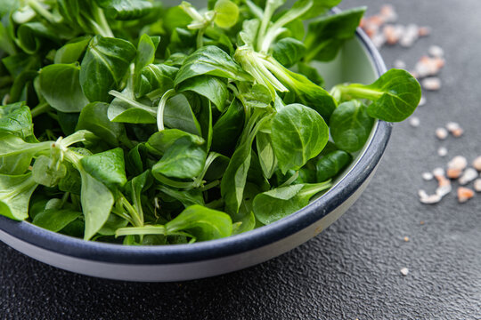 fresh green salad mache leaves healthy meal food snack on the table copy space food background rustic top view 