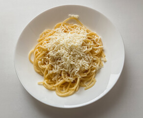 Pasta with cheese in a white plate. Fast Recipes.