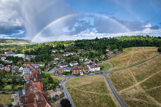 UK- Rainbow over houses in Dorking, Surrey- a lovely market town set in the Surrey Hills