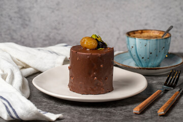 Chocolate and chestnut cake on a dark background. Delicious cake with cream filling. Studio shoot. Bakery products. close up