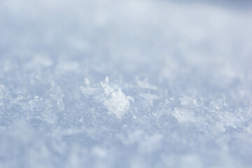 natural snowflakes on snow, photo of real snowflakes. Winter snow background. Snowflake close-up. Macro photo. Copy space.