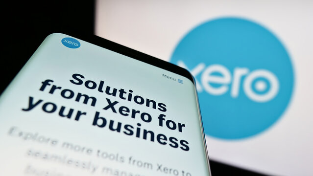 Stuttgart, Germany - 12-30-2022: Smartphone with webpage of New Zealand software company Xero Limited on screen in front of business logo. Focus on top-left of phone display.