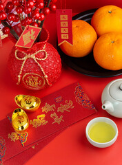 Happy Chinese New Year with Mandarin Oranges, Chinese Sentences respectively means "luck", "get what one wants", "good luck", "all is well", on the red envelopes (Ang pao) means "all things matters".