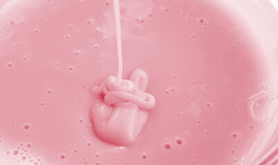 Squeezed out cosmetic pink gel . Close-up photo of skin care products