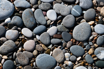 Fototapeta na wymiar Pebbles and stones : abstract composition. Background made of multicolored pebbles