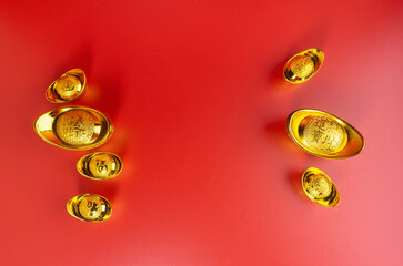 Fototapeta na wymiar Happy Chinese New Year. Chinese Gold Sycee. Isolated red. Copy space. Usable for wallpaper, greeting card, design.