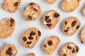 Biscotti cantucci cookies with almond and cranberry on white background top view