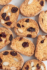 Biscotti cantucci cookies with almond and cranberry on white background top view