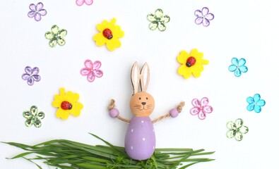 Young Hare, Easter bunny sitting on green meadow