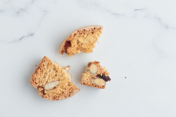 Biscotti cantucci cookies with almond and cranberry on white background top view