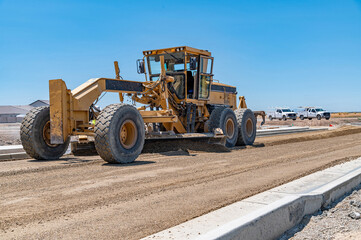 Obraz premium Yellow excavator, highway construction. Repair road works.