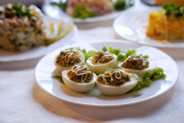 Deviled eggs aka stuffed eggs. Traditional Ukrainian food on the holiday table.