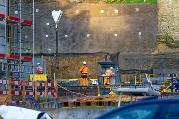 Construction site at Swiss City of Biel Bienne with wall in the background on a sunny autumn day. Phot taken November 10th, 2022, Biel Bienne, Switzerland. - obrazy, fototapety, plakaty
