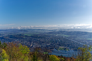 Aerial view from village Magglingen Macolin, Canton Bern, over City of Biel Bienne and lake with Aaare River on a blue cloudy autumn day. Photo taken November 10th, 2022, Magglingen, Switzerland.