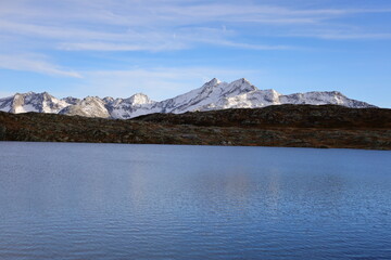 View on a lake in the Grimsel Pass which is a mountain pass in Switzerland, crossing the Bernese Alps at an elevation of 2,164 metres