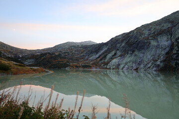 View on a lake in the Grimsel Pass which is a mountain pass in Switzerland, crossing the Bernese...