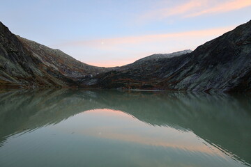 View on a lake in the Grimsel Pass which is a mountain pass in Switzerland, crossing the Bernese...