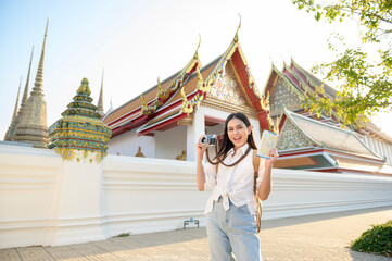 Beautiful tourist woman on vacation sightseeing and exploring Bangkok city, Thailand, Holidays and...