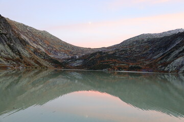View on a lake in the Grimsel Pass which is a mountain pass in Switzerland, crossing the Bernese...
