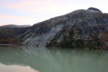 View on a lake in the Grimsel Pass which is a mountain pass in Switzerland, crossing the Bernese...