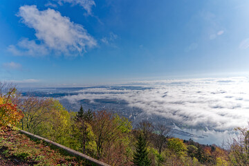 Aerial view from village Magglingen Macolin, Canton Bern, over City of Biel Bienne and lake with Aaare River on a blue cloudy autumn day. Photo taken November 10th, 2022, Magglingen, Switzerland.